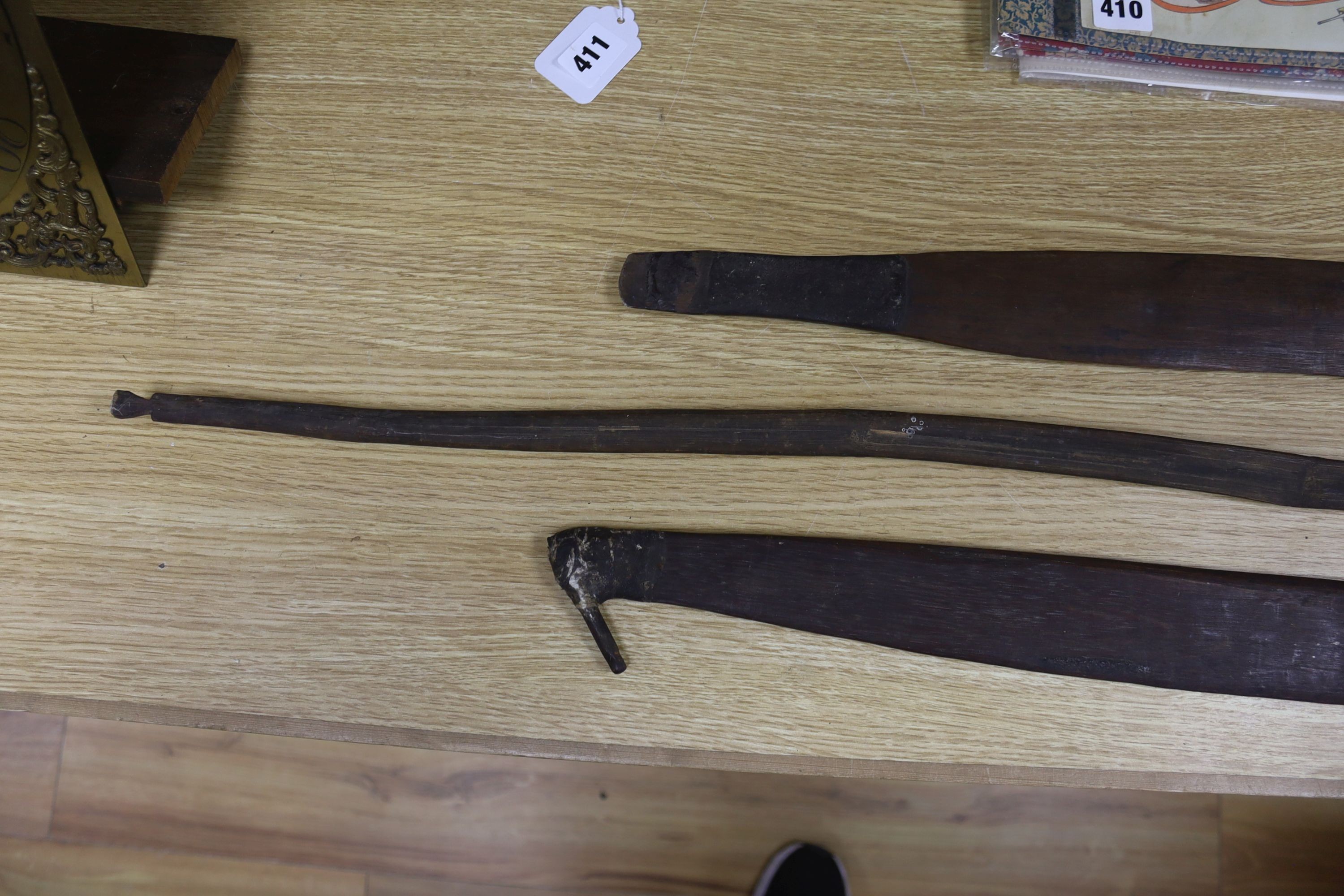 Two chip-carved paddle blades and bow, possibly Fijian.